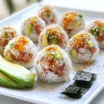- Sushi Rice: You need 1 cup of sushi rice. This rice helps create that sticky texture we love in sushi. - Sushi-Grade Tuna: Use ½ pound of sushi-grade tuna, diced into small cubes. This tuna adds fresh flavor. - Spicy Tuna Filling Components: - 2 tablespoons mayonnaise - 1 tablespoon Sriracha sauce (add more for heat) - 1 tablespoon soy sauce - 1 teaspoon sesame oil - 1 green onion, finely chopped - Optional Garnishes: - 1 sheet nori (seaweed), cut into small squares - Sesame seeds for a decorative touch - Thin avocado slices for serving (optional) These ingredients come together to create a dish that is not only tasty but also fun to make. You can adjust the spice to make it just right for your taste. If you want to explore other flavors, consider adding more herbs or different sauces. - Rinsing Techniques: Rinse your sushi rice under cold running water. Do this until the water runs clear. This step removes excess starch, helping your rice become sticky. - Cooking Method: In a medium saucepan, mix rinsed sushi rice with 1 ¼ cups water. Bring this to a boil over medium-high heat. Once boiling, lower the heat, cover, and let it simmer for 15 minutes. - Steaming and Resting: After 15 minutes, turn off the heat but keep the lid on for 10 more minutes. This allows the rice to steam and become fluffy. - Mixing Ingredients: In a bowl, combine ½ pound of diced tuna, 2 tablespoons of mayonnaise, 1 tablespoon of Sriracha, 1 tablespoon of soy sauce, 1 teaspoon of sesame oil, and 1 chopped green onion. Stir well to mix everything. - Adjusting Spice Levels: Taste your filling. If you want more heat, add extra Sriracha. This lets you control the spiciness to your liking. - Techniques for Encasing the Filling: When the rice is warm but cool enough to touch, wet your hands to avoid sticking. Take about 2 tablespoons of rice and flatten it in your palm. Put a spoonful of spicy tuna in the center. - Final Presentation Tips: Carefully fold the rice over the filling, sealing it inside. Roll the rice into a ball shape. Place sesame seeds on top for garnish. Add a square of nori on the side for extra flavor. Present your sushi balls on a platter, with avocado slices if you wish. - Rinsing Suggestions: Start by rinsing the sushi rice under cold water. This helps remove excess starch. Keep rinsing until the water runs clear. This step is key for sticky rice. - Cooking Time Adjustments: Cook the rice over medium-high heat. Once it boils, reduce the heat to low. Cover the pot and simmer for about 15 minutes. Let it sit for another 10 minutes after cooking to steam. - Varieties of Hot Sauce: Sriracha is a great choice for adding heat. Feel free to use other hot sauces like chili garlic or spicy mayo. Each sauce brings its own unique flavor. - Alternative Ingredients: You can add diced jalapeños for more spice. Avocado or mango can balance the heat with a creamy touch. - Best Practices for Rolling Sushi Balls: Wet your hands before shaping the rice. This prevents sticking and helps form a smooth ball. Make sure to securely encase the filling inside. - Serving Temperature Recommendations: Serve sushi balls warm or at room temperature. This helps enhance the flavors and texture. Enjoy them fresh for the best taste! {{image_4}} - Substituting Tuna: For a vegetarian option, use diced avocado or marinated tofu. Both options bring a creamy texture and absorb flavors well. You can also try using jackfruit, which mimics the texture of fish. - Innovative Fillings: Consider adding cucumber or pickled radish for crunch. A mix of carrots and bell peppers can also add color and taste. - Adding Fresh Vegetables: You can mix in shredded carrots, crunchy cucumber, or spicy radishes. These add a fresh bite and contrast nicely with the spicy tuna. - Specialty Sauces: Try drizzling your sushi balls with wasabi mayo or teriyaki sauce. These sauces can enhance the flavor and make each bite exciting. - Mini Sushi Balls for Appetizers: Make smaller balls for a fun party snack. They are perfect for finger food and easy to eat in one bite. - Larger Versions for Main Courses: If you want a hearty meal, form larger balls. You can serve them as a main dish with a side of soy sauce for dipping. To keep your spicy tuna sushi balls fresh, store them right. Here are a few tips: - Refrigeration Tips: Place the sushi balls in an airtight container. Keep them in the fridge for quick access. They taste best within a day of making. - Freezing Recommendations: If you want to store them longer, freeze the sushi balls. Wrap each ball in plastic wrap, then place them in a freezer bag. They can last up to a month in the freezer. Knowing how long your sushi balls last helps keep them tasty. Here’s what to remember: - Best Practices for Freshness: Always eat your sushi balls within 24 hours for the best flavor. Store them properly in the fridge or freezer to maintain freshness. - Signs of Spoilage: Check for any off smells or changes in texture. If the rice feels dry or hard, it’s time to toss them. Don’t eat sushi that looks or smells bad. If you need to reheat your sushi balls, do it safely. Here’s how: - Safest Methods to Reheat: The best way is to let them sit at room temperature for a bit. If you want to warm them, use a microwave on low power for 10-15 seconds. Avoid overheating. This keeps the rice soft and the filling tasty. You want sushi-grade tuna. It must be fresh and high quality. Look for yellowfin or bluefin tuna. These types have the right taste and texture. Always buy from a trusted source. Ask your fishmonger about the best options. They can guide you to the freshest catch. Yes, you can make these sushi balls ahead of time. Prepare the sushi rice and spicy tuna filling. Shape the balls and keep them in the fridge. However, they taste best fresh. Make sure to cover them with plastic wrap to avoid drying out. To adjust the spice, change the amount of Sriracha. Add more for extra heat. You can also mix in chili oil for a different flavor. Taste the filling before you shape the balls. This way, you can find the perfect heat for you. Yes, there are gluten-free soy sauce options. Look for tamari, a gluten-free soy sauce. Many brands offer this. Always check the label to make sure. This keeps your spicy tuna sushi balls safe for gluten-free diets. You can serve sushi balls with a variety of sides. Try thin avocado slices for creaminess. Pickled ginger adds a nice tang. You can also serve with soy sauce for dipping. These options enhance the flavors of your sushi balls. Now you have a complete guide to making spicy tuna sushi balls. From selecting the right ingredients to shaping your sushi, each step is simple. Remember to adjust spice levels to your liking and explore different flavors. You can create variations for everyone, and proper storage keeps your sushi fresh. Enjoy making this delicious dish and impressing friends and family. Dive into this fun cooking adventure and savor every bite. Your skills in sushi making will surely grow!