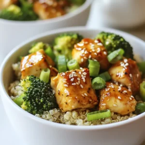 - 2 boneless, skinless chicken breasts, cubed - 2 cups fresh broccoli florets - 1 cup quinoa, rinsed - 2 tablespoons olive oil, divided - 3 cloves garlic, minced - 1 tablespoon fresh ginger, finely grated - 3 tablespoons low-sodium soy sauce - 1 tablespoon honey - 1 teaspoon sesame oil - Salt and pepper to taste - 1 teaspoon sesame seeds, for garnish - 2 green onions, thinly sliced, for garnish - Bell peppers for a pop of color - Carrots for sweetness and crunch - Spinach for extra greens - Crushed peanuts for added texture - Chicken: Packed with protein, it helps build and repair muscles. - Broccoli: Full of vitamins C and K, it supports your immune system and bone health. - Quinoa: A great grain that provides fiber and essential amino acids for energy. - Olive Oil: Contains healthy fats which promote heart health and reduce inflammation. - Garlic: Known for its antioxidant properties, it boosts your immune system. - Ginger: Aids digestion and adds a spicy kick to your meal. - Soy Sauce: Adds flavor while being low in calories. - Honey: A natural sweetener that can help soothe sore throats. - Sesame Oil: Rich in antioxidants, it enhances heart health. - Green Onions: Provide a fresh taste and are low in calories. - Sesame Seeds: High in calcium, they support bone health. These ingredients work together to create a meal that is not just tasty but also full of nutrients. Each bite gives you a boost of energy and health benefits. {{ingredient_image_2}} Start by rinsing 1 cup of quinoa in cold water. This removes any bitterness. Use a fine-mesh sieve for this step. In a medium saucepan, mix the rinsed quinoa with 2 cups of water. Bring this to a boil over high heat. After it boils, reduce the heat to low. Cover the pot and let it simmer for 15 minutes. The water should fully absorb. Then, take it off the heat and let it sit for another 5 minutes. Fluff the quinoa gently with a fork and set it aside. While your quinoa cooks, heat 1 tablespoon of olive oil in a large skillet over medium heat. Add 2 cubed chicken breasts to the skillet. Season the chicken with salt and pepper. Cook the chicken for 5 to 7 minutes. Stir occasionally until it turns golden brown and is cooked through. Once your chicken is nearly done, push it to one side of the skillet. Add another tablespoon of olive oil to the pan. Then, add 3 minced garlic cloves, 1 tablespoon of finely grated ginger, and 2 cups of broccoli florets. Sauté these together for 4 to 5 minutes. Stir often until the broccoli is tender but still bright green. In a small bowl, whisk together 3 tablespoons of low-sodium soy sauce, 1 tablespoon of honey, and 1 teaspoon of sesame oil. Once mixed well, pour this sauce over the chicken and broccoli in the skillet. Stir to coat everything evenly. Let it cook together for an extra 2 minutes so the flavors meld nicely. To assemble your bowls, divide the fluffy quinoa among four serving bowls. Top each bowl generously with the savory chicken and broccoli mixture. Finish the bowls by sprinkling 1 teaspoon of sesame seeds on top. Add sliced green onions for a fresh touch. Serve these bowls hot for a delightful meal! Enjoy the mix of flavors and textures in every bite. The best way to cook chicken for this dish is pan-searing. This method gives you a nice golden crust. Use medium heat and add oil to the pan. Season the chicken with salt and pepper. Cook for 5-7 minutes until it is golden brown and fully cooked. For extra flavor, you can marinate the chicken in soy sauce before cooking. This adds a nice depth to the dish. To cook broccoli so it stays bright green, steam it lightly. Add the florets to boiling water for just 2-3 minutes. Then, transfer them to ice water. This method keeps the color and crunch. If you sauté the broccoli, do it quickly. Add it to the pan when the chicken is almost done. Cook it for 4-5 minutes with garlic and ginger for great taste. You can change the sauce to suit your taste. For a spicy kick, add red pepper flakes. If you like it sweet, use more honey or maple syrup. Add lime juice for a tangy twist. If you want a nutty flavor, mix in some peanut butter. Try different sauces, like teriyaki or hoisin, to keep things exciting. Pro Tips Use Fresh Ingredients: Always opt for fresh broccoli and high-quality chicken to enhance the flavor and nutritional value of your dish. Perfectly Cooked Quinoa: Ensure you rinse the quinoa thoroughly to remove bitterness and let it sit covered after cooking to achieve a fluffy texture. Adjust the Sauce: Feel free to modify the soy sauce and honey ratio based on your taste preference, adding more honey for sweetness or soy sauce for saltiness. Meal Prep Friendly: This dish can be made in advance and stored in the fridge for up to three days. Just reheat before serving! {{image_4}} You can easily make a vegetarian version of this meal. Substitute chicken with firm tofu. Press the tofu to remove excess water, then cube it. Cook the tofu until golden brown, just like the chicken. You can also add more veggies, like bell peppers or carrots, to boost flavor and nutrition. This dish is nearly gluten-free! Just replace low-sodium soy sauce with tamari. Tamari is a gluten-free soy sauce alternative. Ensure that all other ingredients are also gluten-free. This way, you can enjoy your bowls without worry. If you want to switch up proteins, try shrimp or tempeh. Shrimp cooks quickly and adds a nice seafood flavor. If you choose tempeh, slice it thinly and sauté it just like chicken. Both options keep the dish tasty and satisfying while adding variety. After making your Chicken & Broccoli Bowls, let them cool down. Place leftovers in an airtight container. These bowls will stay fresh in the fridge for up to three days. Make sure to separate the chicken, broccoli, and quinoa if possible. This helps keep the texture nice when you reheat them. To reheat your bowls, the microwave is a quick option. Put your bowl in and heat for about 1-2 minutes. Stir halfway through to heat evenly. You can also use a skillet on low heat. Add a little water or oil to keep everything moist. Heat for about 5 minutes, stirring often. This will keep the chicken tender and the broccoli bright. You can freeze your Chicken & Broccoli Bowls too! Just cool them completely first. Use freezer-safe containers or bags. These bowls can last up to three months in the freezer. When you're ready to eat, thaw them overnight in the fridge. Then reheat using the tips above. This way, you can enjoy a healthy meal anytime! Yes, you can use frozen broccoli. It is quick and easy. Just add it to the pan directly. Cook it for a few extra minutes. This way, you still get the crunch and color. The taste remains delicious and nutritious. If you don't have quinoa, use brown rice or couscous. Both options are great. They add texture and flavor. Brown rice gives a nutty taste. Couscous cooks fast and is fluffy. You can also try farro for a different texture. To lower the calories, use less oil and soy sauce. You can also skip the honey. Add more veggies to fill your bowl. This keeps the meal satisfying without extra calories. Yes, meal prepping is a smart choice! Cook everything ahead of time. Store the chicken, broccoli, and quinoa in separate containers. This helps keep them fresh. When you’re ready to eat, just mix and enjoy! This article covered a tasty quinoa bowl recipe. We explored key ingredients and their health benefits. You learned step-by-step cooking tips, from chicken prep to sauce making. We shared variations for different diets and storage tips for leftovers. Remember, cooking can be fun and easy! Feel free to customize these bowls to your taste. Try meal prepping for quick lunches. Enjoy your cooking adventure!