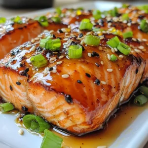 - 4 salmon fillets (approximately 6 oz each) - 1/4 cup honey - 4 cloves garlic, finely minced - 2 tablespoons soy sauce - 1 tablespoon olive oil (plus additional for the skillet) - 1 tablespoon fresh ginger, freshly grated - 1 tablespoon rice vinegar - Salt and freshly ground black pepper to taste - 2 green onions, finely chopped (for garnishing) - Sesame seeds (for garnishing) To make honey garlic glazed salmon, gather these fresh ingredients. Use high-quality salmon fillets for the best taste. Honey adds a sweet touch, while garlic gives a rich flavor. The soy sauce brings saltiness, and olive oil helps cook the salmon perfectly. Fresh ginger adds a zing, and rice vinegar balances the flavors. Remember to season with salt and pepper. This simple step enhances the salmon's taste. For garnishing, green onions and sesame seeds bring color and crunch. With these ingredients, you are ready to create a dish that impresses! {{ingredient_image_2}} To make the sauce, gather your ingredients in a bowl. You need honey, minced garlic, soy sauce, olive oil, grated ginger, and rice vinegar. Mix these well until they blend into a smooth sauce. This step is key. Blending these flavors gives the dish its tasty kick. Each ingredient adds depth to the sauce, making it sweet and savory. Next, let's season the salmon. Take your fillets and sprinkle salt and freshly ground black pepper on both sides. Be generous with the seasoning. This step helps boost the salmon's flavor. A well-seasoned fillet creates a strong base for your dish. It enhances the taste of the honey garlic glaze, making it even better. Now, heat your skillet over medium heat. Add a small splash of olive oil. Wait about one minute until the oil shimmers. This shows it's hot enough. Carefully place the salmon fillets in the skillet, skin-side down. Cook them for about 4-5 minutes. Do not move the fillets during this time. This helps the skin get crispy and golden. Next, gently flip the salmon using a spatula. Once flipped, pour the honey garlic glaze over the fillets. Make sure each piece is covered in the sauce. Continue cooking for another 4-5 minutes. Use a spoon to baste the salmon with the sauce now and then. This adds flavor and helps create a beautiful glaze. To check if the salmon is ready, use a fork. It should flake easily when cooked. Once it&rsquo;s ready, remove the skillet from the heat. Let the salmon rest for a couple of minutes to keep it moist. Now your honey garlic glazed salmon is ready to serve! Enjoy plating it with garnishes for a beautiful dish. To ensure the best flavor, balance the honey and soy sauce. Honey gives sweetness, while soy sauce adds saltiness. Mix them well to create a rich glaze. Timing matters too. Pour the glaze over the salmon only after flipping it. This helps the flavors stick and caramelize. Let it cook for the full time to get that perfect shine. You can sear or bake your salmon. Searing gives a crispy skin and rich taste. To sear, heat a skillet and add olive oil. Place the salmon skin-side down for 4-5 minutes. If you prefer baking, preheat your oven to 375&deg;F. Bake for about 15 minutes. Both methods keep the salmon moist, but searing often gives better texture. For plating, use a nice white plate to show off the colors. Place the salmon in the center, and drizzle some extra glaze on top. Garnish with chopped green onions and sesame seeds for a pop of color. You can also serve the salmon with steamed rice and saut&eacute;ed veggies for a full meal. This makes your dish look and taste amazing! Pro Tips Use Fresh Ingredients: Always opt for fresh salmon and fresh garlic for the best flavor and texture in your dish. Control the Heat: Make sure to cook the salmon over medium heat to avoid burning the glaze while ensuring the fish cooks through. Baste for Extra Flavor: Basting the salmon with the glaze during cooking enhances the flavor and helps achieve a beautiful finish. Let it Rest: Allow the salmon to rest after cooking to help retain its moisture, making it more tender and juicy when served. {{image_4}} You can switch up the sweeteners in this recipe. Maple syrup adds a rich, earthy flavor. Agave gives a milder sweetness. Both work well with the salmon. You can also add herbs and spices. Fresh thyme or basil can brighten the dish. Red pepper flakes can give it a nice kick. Grilling the salmon is an excellent option. It adds a smoky flavor that enhances the glaze. Preheat your grill and oil the grates. Cook the salmon skin-side down for about six minutes. Flip it carefully and glaze it before finishing on the grill. Baking is another simple method. Preheat your oven to 400&deg;F. Place the seasoned salmon on a baking sheet. Pour the honey garlic glaze over the fillets. Bake for about 12-15 minutes. This method keeps the salmon moist and flaky. Serve this salmon with steamed rice. It absorbs the glaze well and balances the flavors. Add saut&eacute;ed vegetables like broccoli or green beans for color and nutrition. A fresh salad with citrus dressing pairs nicely too. For a complete meal, consider a light white wine. A chilled Sauvignon Blanc enhances the dish&rsquo;s sweetness. To keep your honey garlic glazed salmon fresh, follow these steps: - Refrigerate: Place leftover salmon in an airtight container. Store it in the fridge for up to three days. Make sure it cools before sealing the container to avoid moisture buildup. - Freeze: For longer storage, wrap the salmon tightly in plastic wrap. Then place it in a freezer-safe bag. This way, it can last for up to three months in the freezer. When ready to eat, thaw it in the fridge overnight. To reheat your salmon while keeping its flavor and texture intact, use these methods: - Oven: Preheat your oven to 275&deg;F (135&deg;C). Place salmon on a baking sheet. Cover it with foil to avoid drying out. Heat for about 15 minutes, or until warmed through. - Skillet: Heat a non-stick skillet over low heat. Add a small amount of olive oil. Place the salmon in the skillet and cover it. Cook for 5-7 minutes to warm gently. Avoiding Overcooking: Always keep a close eye on your salmon while reheating. Salmon is done when it is warm, but still moist. Overcooking can make it dry and tough. Yes, you can use frozen salmon. Just remember to thaw it first. Place the salmon in your fridge overnight. If you need it faster, you can submerge it in cold water for about an hour. Avoid using hot water as it can cook the fish unevenly. If you need to avoid soy sauce, use coconut aminos. It has a similar taste but is soy-free. You can also try tamari for a gluten-free option. Other choices include liquid aminos or even broth for a lighter flavor. Salmon is ready when it flakes easily with a fork. Look for a change in color from bright pink to a more opaque hue. The internal temperature should be around 145&deg;F. You can use a meat thermometer for accuracy. Honey garlic glazed salmon is quite healthy. Salmon is rich in omega-3 fatty acids, which are good for your heart. Honey adds sweetness but also contains antioxidants. The garlic can help boost your immune system. Overall, it&rsquo;s a balanced dish packed with nutrients. This blog post covered how to make a tasty honey garlic glazed salmon. We explored the key ingredients, like salmon fillets, honey, and garlic. You learned step-by-step instructions, tips to enhance flavor, and ideas for variations. We also discussed storage and reheating methods for leftovers. Now, you have the tools to create a delicious meal. Enjoy experimenting with different ingredients and techniques. Cooking seafood can be fun and rewarding! Try it out and impress your family or friends. Happy cooking!